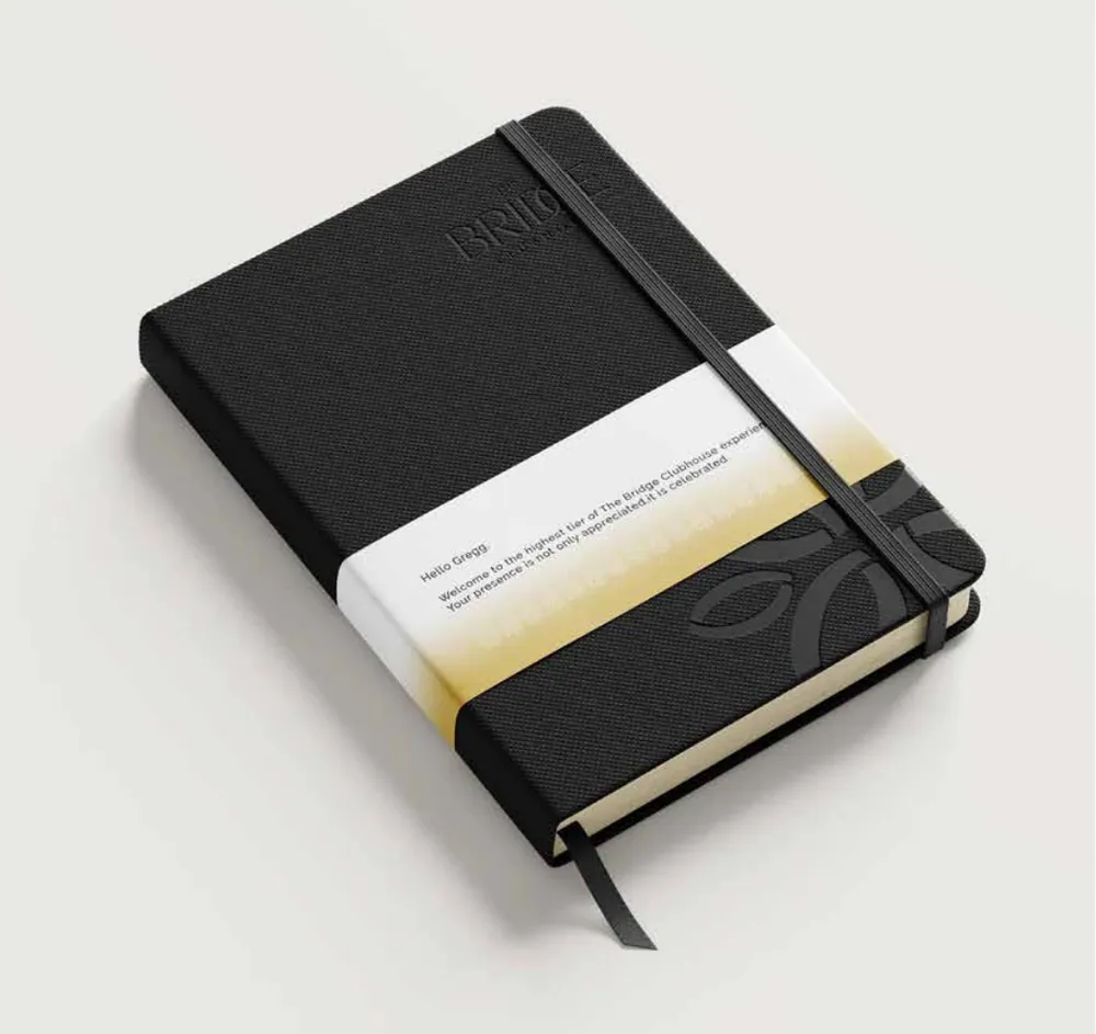 Notebook, branded with The Bridge Clubhouse identity