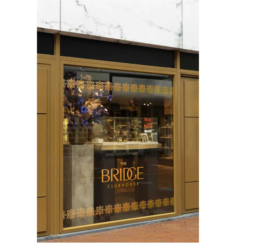 Window graphics, branded with The Bridge Clubhouse identity