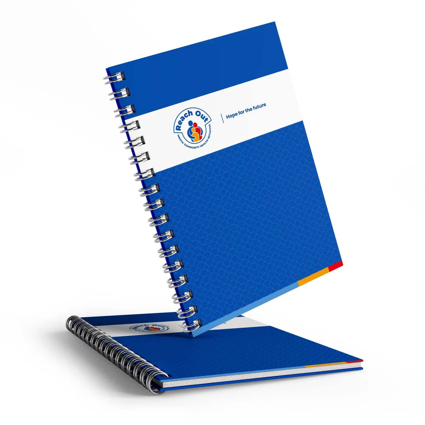 Notebook, branded with the Reach Out Mbuya identity